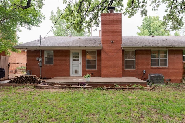 320 E 13th St, Edmond, OK 73034 - rear view of property featuring a chimney, brick siding, a patio area, and roof with shingles