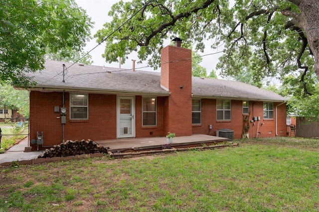 320 E 13th St, Edmond, OK 73034 - back of property with a chimney, brick siding, a patio area, and roof with shingles