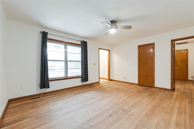 320 E 13th St, Edmond, OK 73034 - unfurnished bedroom with light wood-style floors and ceiling fan
