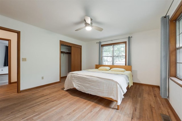320 E 13th St, Edmond, OK 73034 - bedroom with light wood-style flooring, a closet, and a ceiling fan