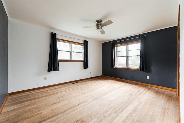 320 E 13th St, Edmond, OK 73034 - unfurnished room with light wood-style floors and a ceiling fan