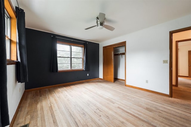 320 E 13th St, Edmond, OK 73034 - unfurnished bedroom featuring light wood-style floors, a closet, and ceiling fan
