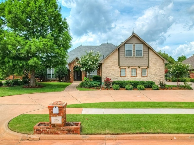325 NW 146th St, Edmond, OK 73013 - view of front of property with stone siding and a front yard