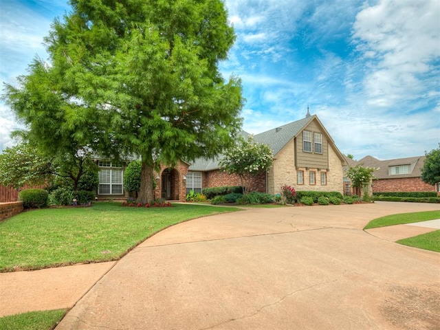 325 NW 146th St, Edmond, OK 73013 - view of front of home featuring a front yard and stone siding