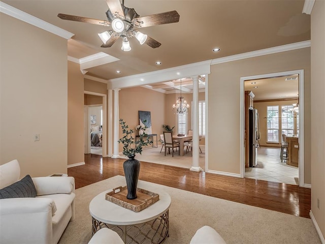 325 NW 146th St, Edmond, OK 73013 - living area featuring decorative columns, crown molding, ceiling fan, a chandelier, and recessed lighting