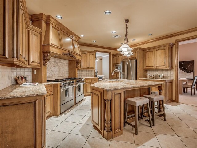 325 NW 146th St, Edmond, OK 73013 - kitchen featuring stainless steel appliances, light tile patterned floors, tasteful backsplash, an island with sink, and ornamental molding