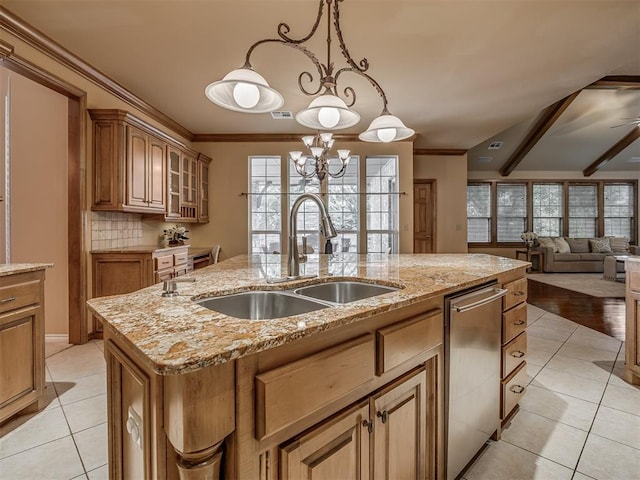 325 NW 146th St, Edmond, OK 73013 - kitchen with an island with sink, light tile patterned floors, glass insert cabinets, open floor plan, and light stone countertops