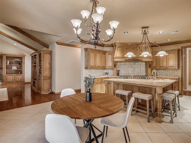 325 NW 146th St, Edmond, OK 73013 - dining area with a chandelier, recessed lighting, light tile patterned floors, and crown molding