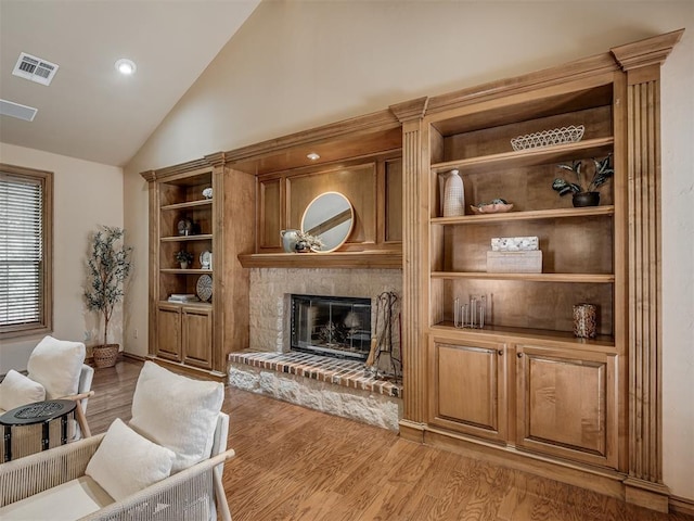 325 NW 146th St, Edmond, OK 73013 - living room with wood finished floors, a brick fireplace, and high vaulted ceiling