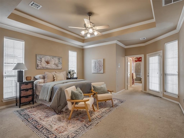 325 NW 146th St, Edmond, OK 73013 - bedroom with a tray ceiling, light carpet, ornamental molding, and a ceiling fan