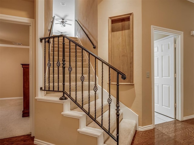 325 NW 146th St, Edmond, OK 73013 - stairway with ceiling fan, wood finished floors, and ornamental molding