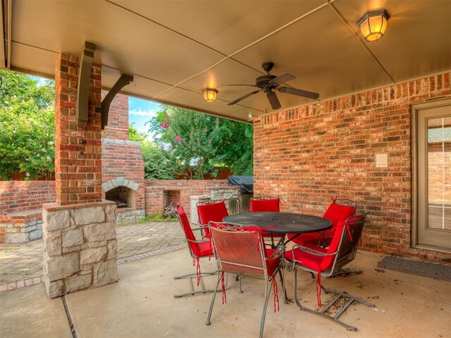 325 NW 146th St, Edmond, OK 73013 - view of patio / terrace featuring an outdoor brick fireplace, ceiling fan, and outdoor dining area