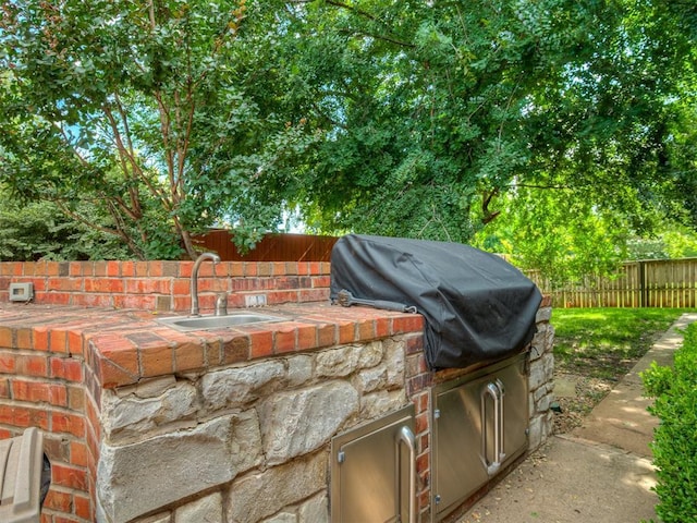 325 NW 146th St, Edmond, OK 73013 - view of patio with a sink and exterior kitchen