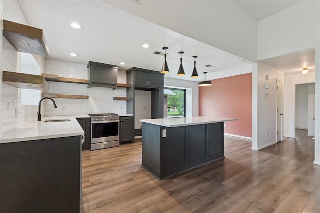 1729 Dena Dr, Edmond, OK 73003 - kitchen featuring stainless steel electric stove, open shelves, tasteful backsplash, light wood-style flooring, and recessed lighting