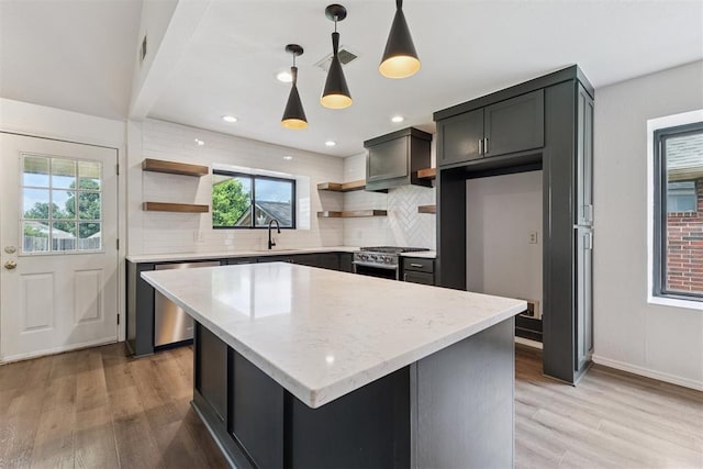 1729 Dena Dr, Edmond, OK 73003 - kitchen with open shelves, stainless steel appliances, decorative backsplash, light wood finished floors, and recessed lighting
