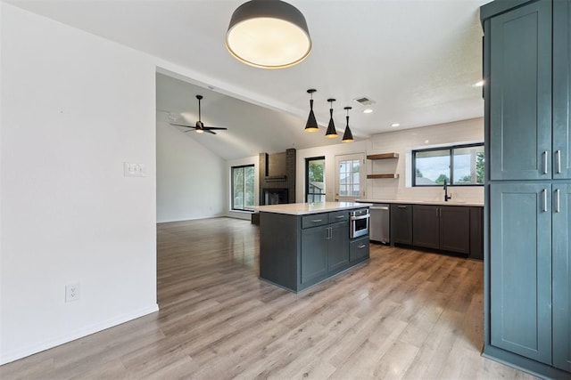 1729 Dena Dr, Edmond, OK 73003 - kitchen featuring dishwasher, backsplash, a kitchen island, light wood-style flooring, and recessed lighting