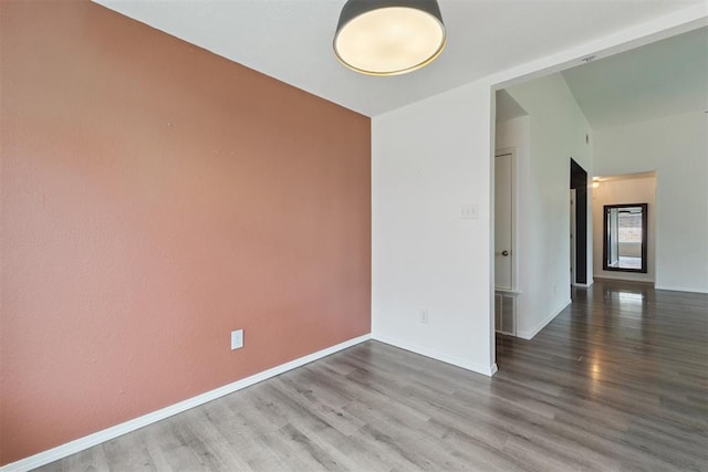 1729 Dena Dr, Edmond, OK 73003 - empty room featuring wood finished floors and baseboards