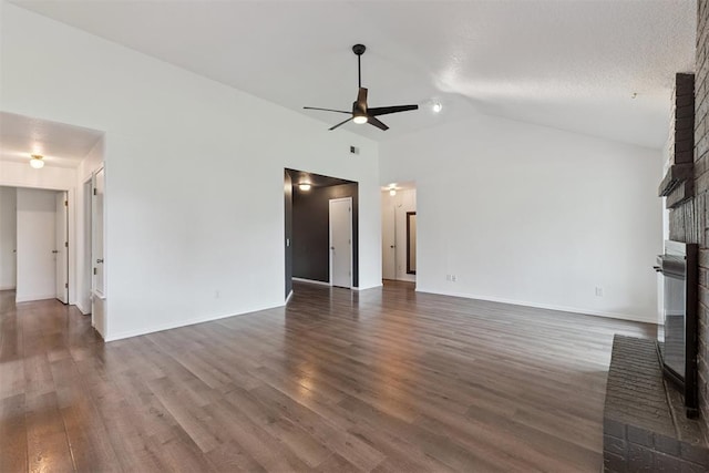 1729 Dena Dr, Edmond, OK 73003 - unfurnished living room with ceiling fan, a fireplace, dark wood-style floors, and lofted ceiling