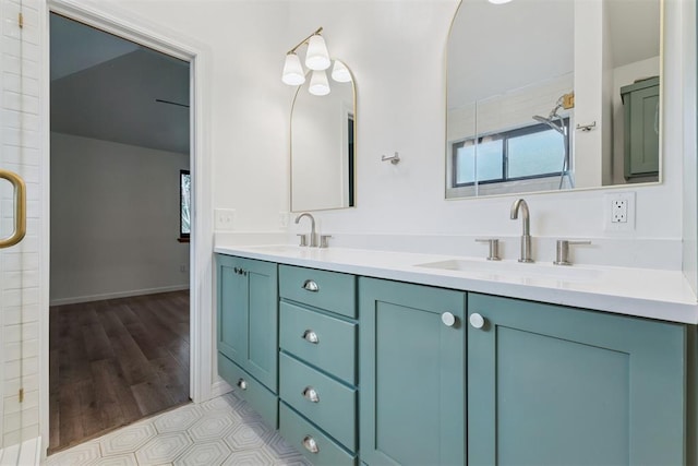 1729 Dena Dr, Edmond, OK 73003 - full bath featuring double vanity and wood finished floors
