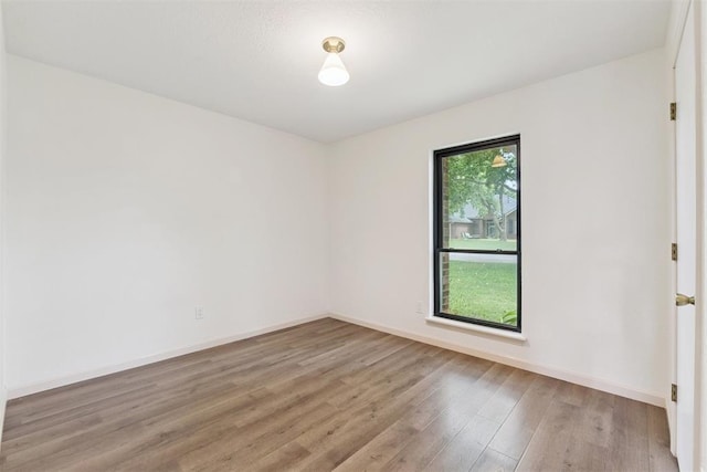 1729 Dena Dr, Edmond, OK 73003 - empty room with light wood-style floors and baseboards