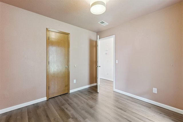 1729 Dena Dr, Edmond, OK 73003 - empty room featuring wood finished floors