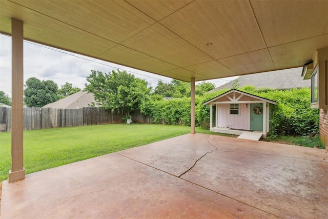 1729 Dena Dr, Edmond, OK 73003 - fenced backyard featuring a patio and an outdoor structure