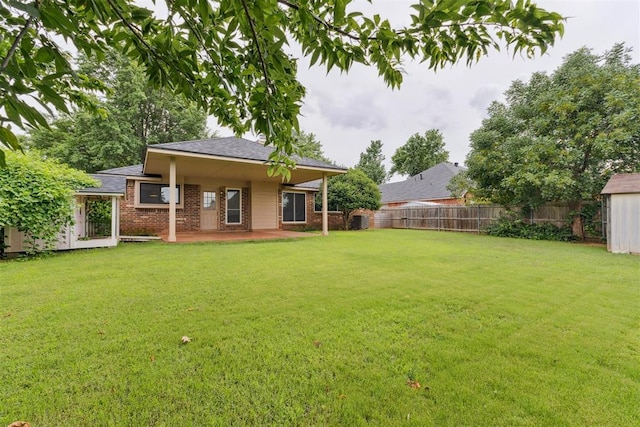 1729 Dena Dr, Edmond, OK 73003 - fenced backyard with a storage unit and a patio