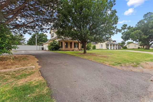 625 N Broadway St, Hydro, OK 73048 - view of property hidden behind natural elements featuring driveway and brick siding