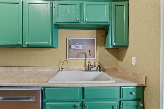 625 N Broadway St, Hydro, OK 73048 - kitchen featuring dishwasher, green cabinetry, a textured wall, and light countertops