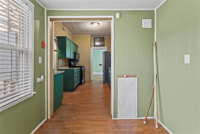 625 N Broadway St, Hydro, OK 73048 - hallway with wood finished floors and crown molding