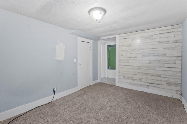625 N Broadway St, Hydro, OK 73048 - carpeted empty room featuring a textured ceiling and baseboards