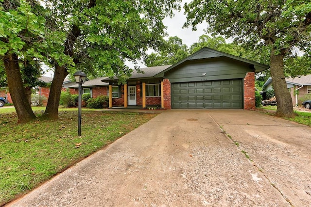 3708 Greenway Ter, Del City, OK 73115 - ranch-style house featuring brick siding, a garage, driveway, a front lawn, and a porch