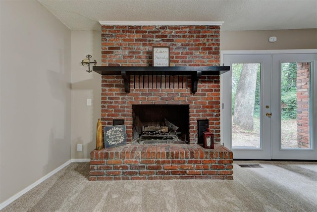 3708 Greenway Ter, Del City, OK 73115 - detailed view of carpet, french doors, a textured ceiling, and a fireplace