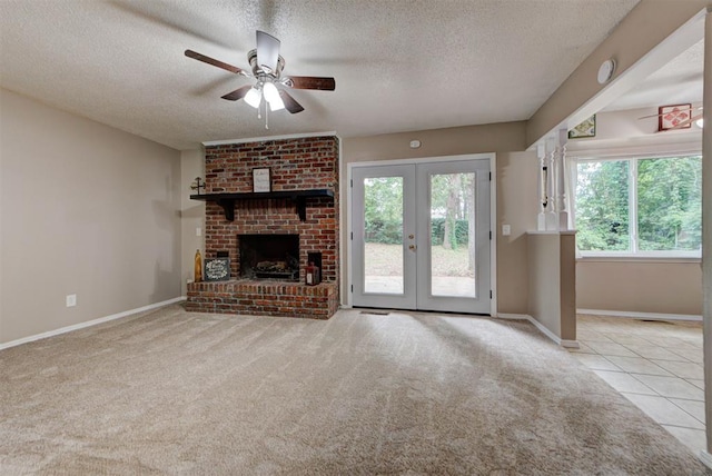 3708 Greenway Ter, Del City, OK 73115 - unfurnished living room with a textured ceiling, a ceiling fan, carpet, french doors, and a fireplace