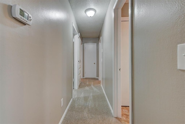 3708 Greenway Ter, Del City, OK 73115 - hallway with light colored carpet and a textured ceiling