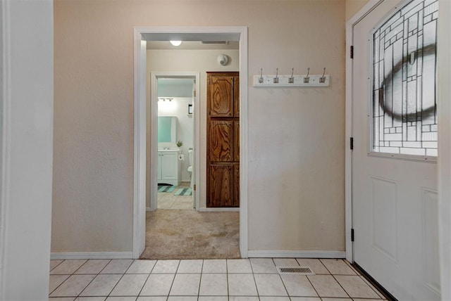 442 W Apple Branch Way, Mustang, OK 73064 - entryway featuring light tile patterned floors and light carpet