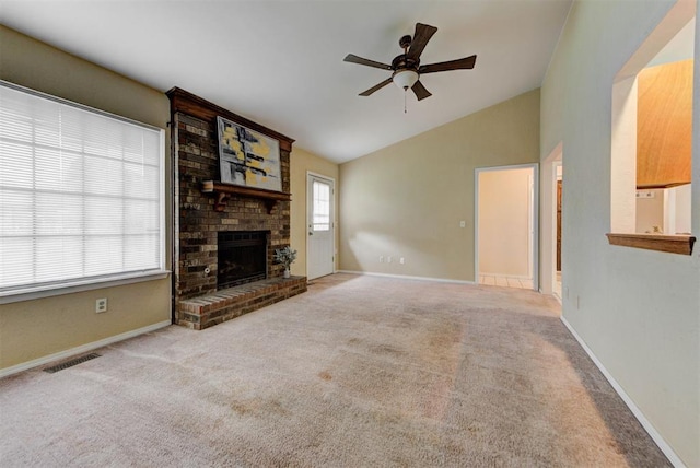 442 W Apple Branch Way, Mustang, OK 73064 - unfurnished living room featuring vaulted ceiling, a ceiling fan, carpet, and a brick fireplace