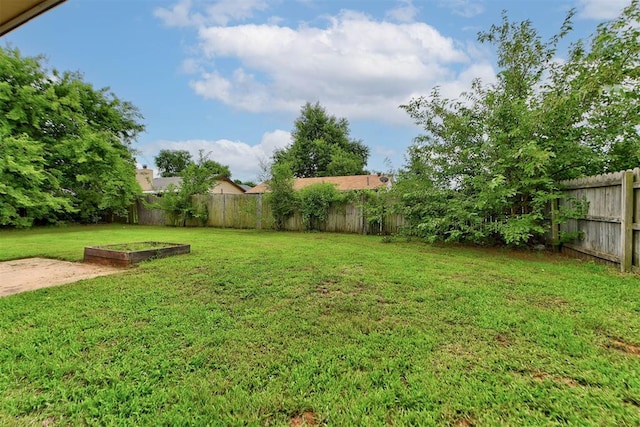 442 W Apple Branch Way, Mustang, OK 73064 - fenced backyard featuring a vegetable garden