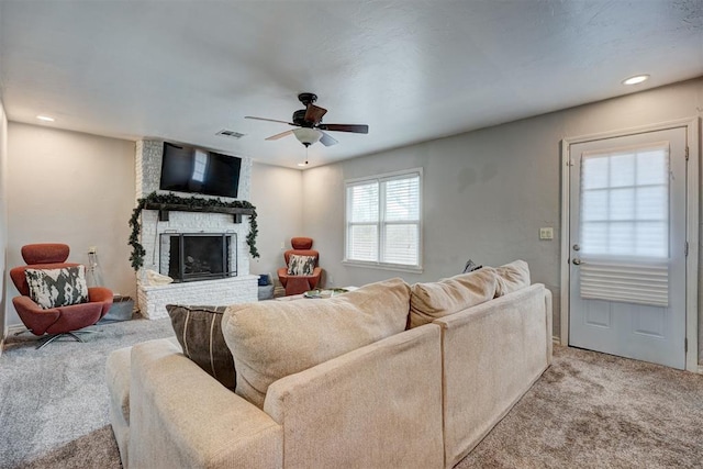 1701 Andover Ct, The Village, OK 73120 - living area with light colored carpet, a fireplace, a ceiling fan, and recessed lighting