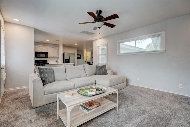 1701 Andover Ct, The Village, OK 73120 - living area featuring ceiling fan, light colored carpet, and recessed lighting