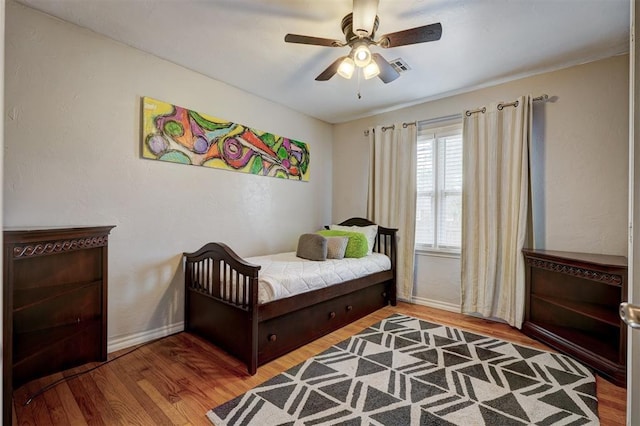 1701 Andover Ct, The Village, OK 73120 - bedroom with wood finished floors and ceiling fan