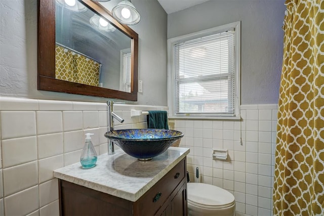 1701 Andover Ct, The Village, OK 73120 - full bath featuring tile walls, a wainscoted wall, vanity, and a shower with shower curtain