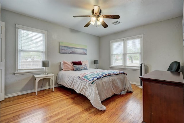 1701 Andover Ct, The Village, OK 73120 - bedroom with light wood-type flooring, an office area, and a ceiling fan