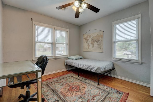 1701 Andover Ct, The Village, OK 73120 - bedroom with a desk, wood finished floors, and a ceiling fan