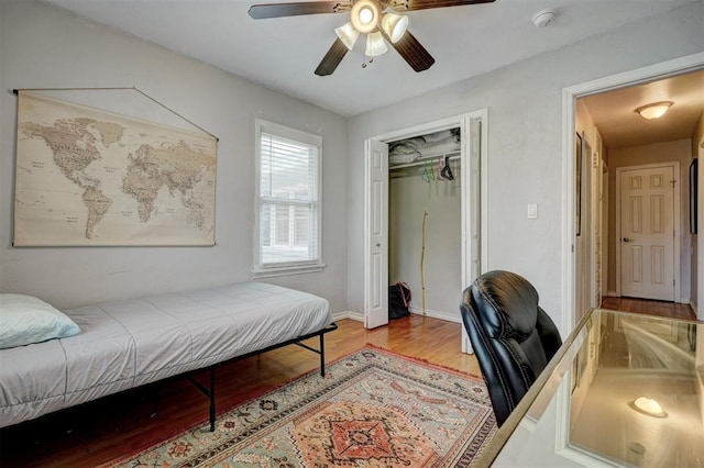 1701 Andover Ct, The Village, OK 73120 - bedroom featuring wood finished floors, a closet, a desk, and a ceiling fan