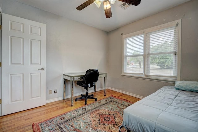 1701 Andover Ct, The Village, OK 73120 - bedroom with wood finished floors, a desk, and ceiling fan