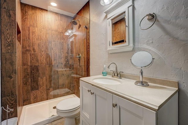 1701 Andover Ct, The Village, OK 73120 - full bathroom with a textured wall, a stall shower, and vanity