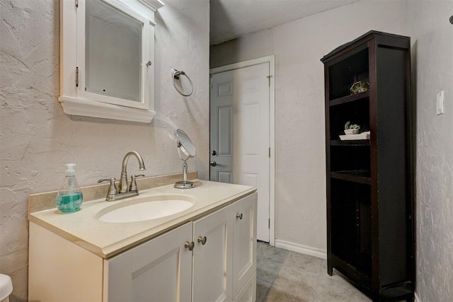 1701 Andover Ct, The Village, OK 73120 - bathroom with vanity, a textured wall, and tile patterned floors