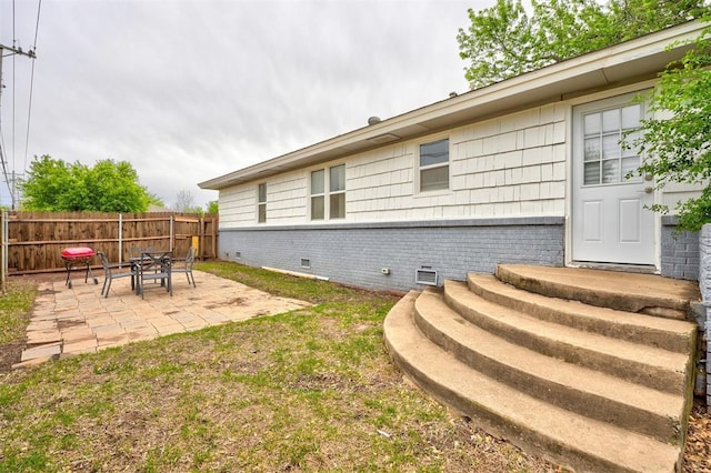 1701 Andover Ct, The Village, OK 73120 - view of home's exterior with brick siding, a patio, and crawl space