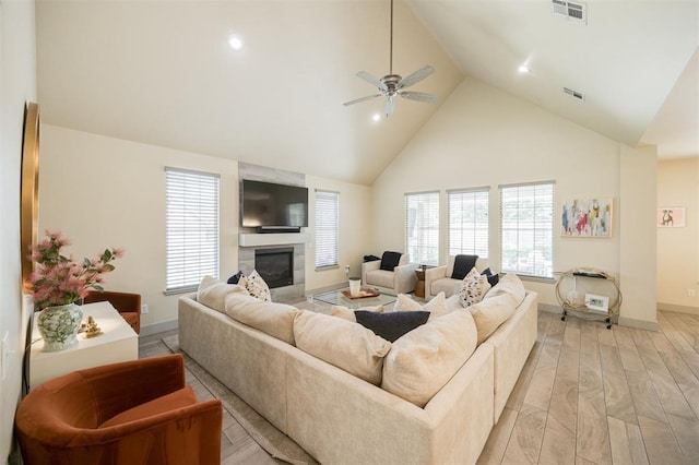 5521 N Miller Ave, Oklahoma City, OK 73112 - living area featuring high vaulted ceiling, a large fireplace, ceiling fan, and recessed lighting